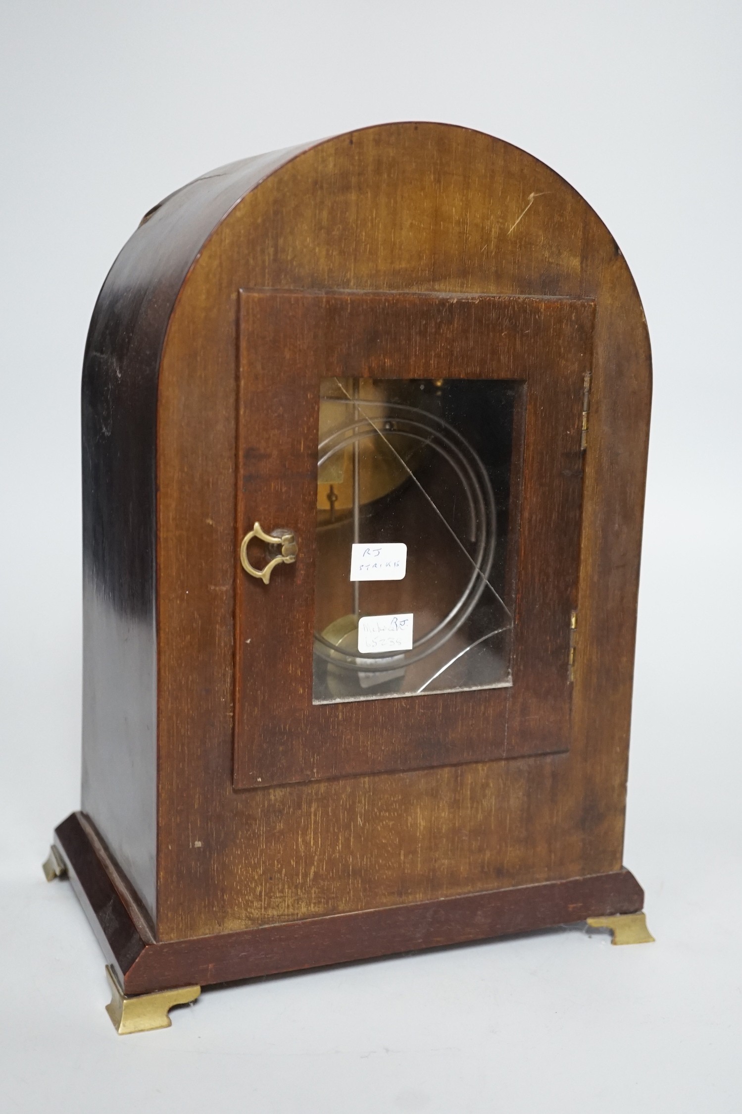 An Edwardian brass mounted mantel clock, 28.5cms high